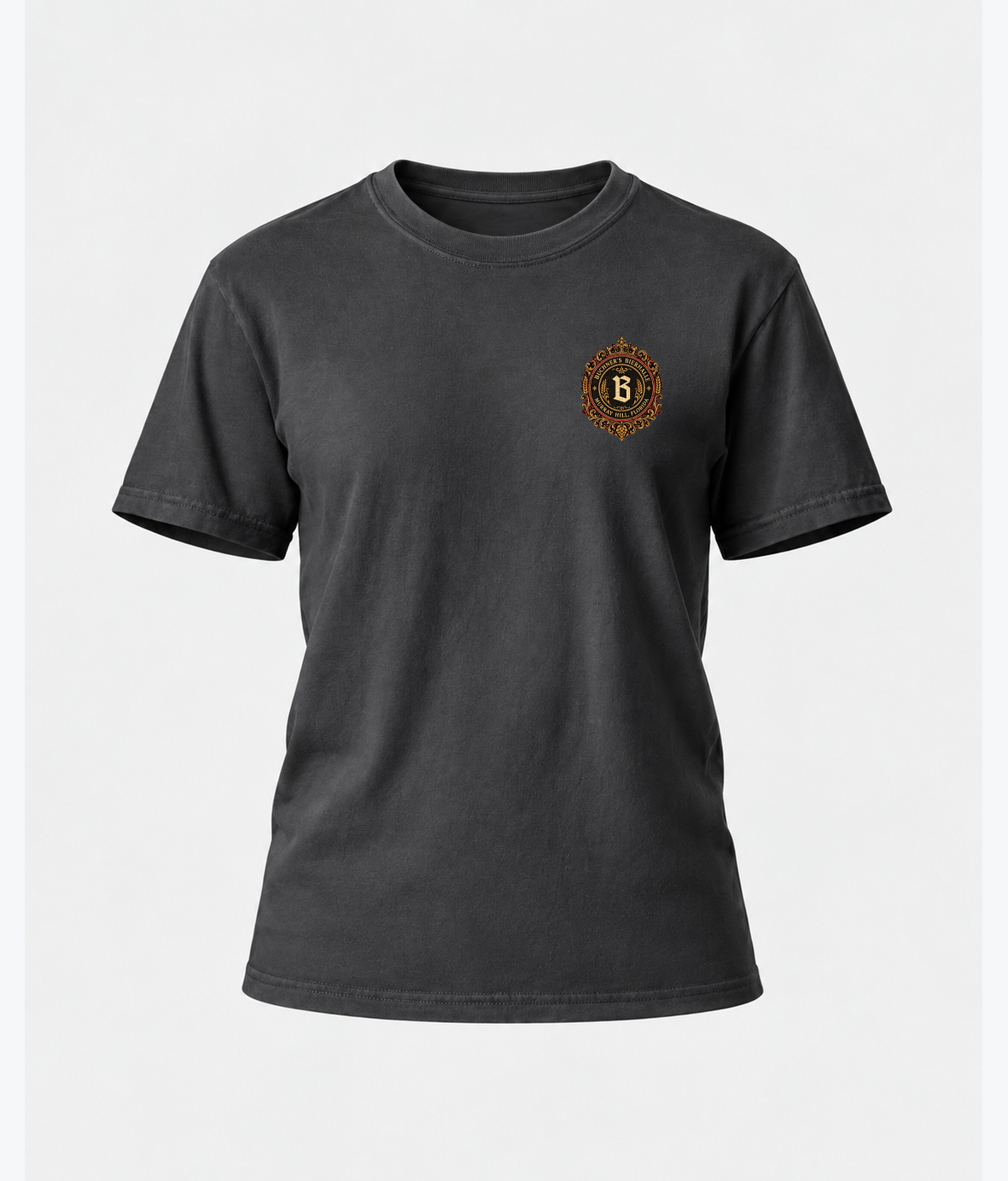 Front product view of the graphite Buchner's Bierhalle Oktoberfest 2026 commemorative T-shirt with a small stylized Buchner's crest on the left chest.